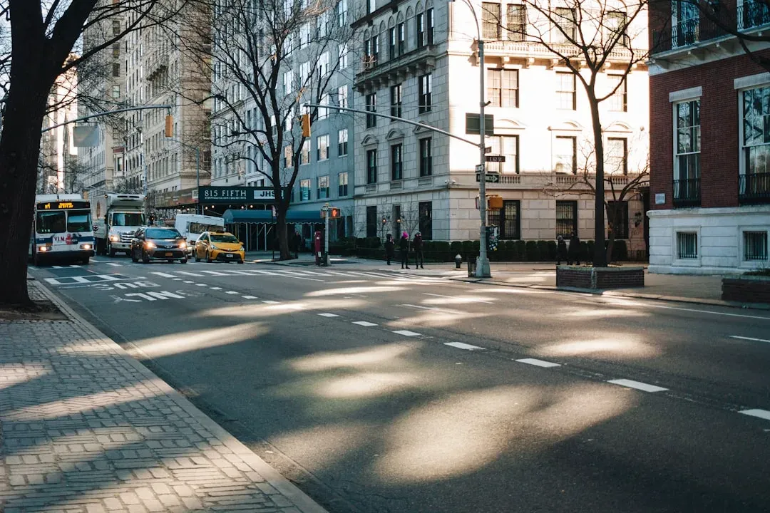 busy city street in Tokyo with pedestrians and cars moving through