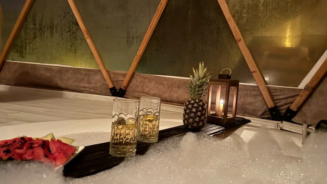 a yurt interior with a bed and a table, 8-14 words